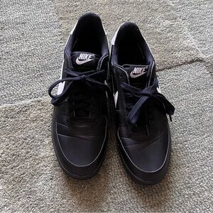 Black and white Nike kicks